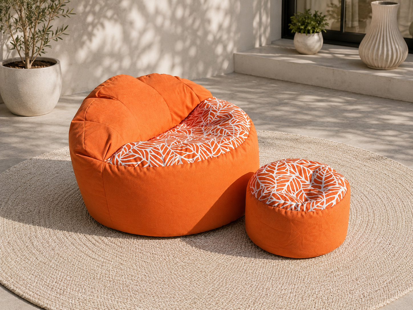 Orange bean bag chair with patterned seat and ottoman on a patio