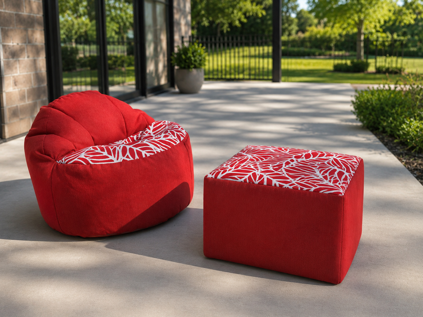 Red bean bag chair and ottoman with white pattern on a patio