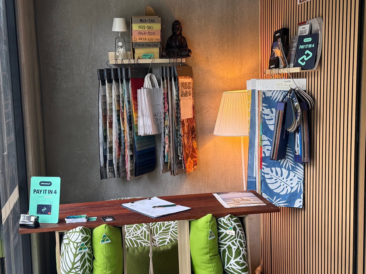lifestyle-entryway-fabric-bags-green-leaf-pillows.jpg