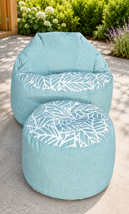Two light blue bean bags with white leaf pattern on a patio