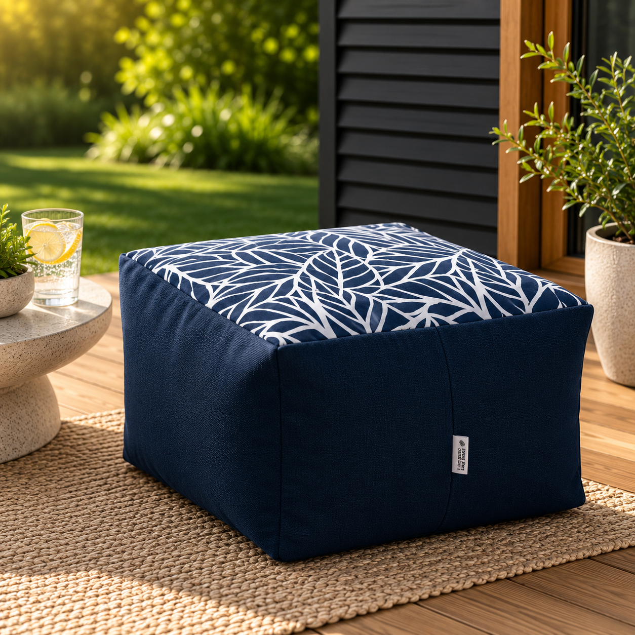navy-blue-ottoman-white-leaf-pattern-patio.jpg