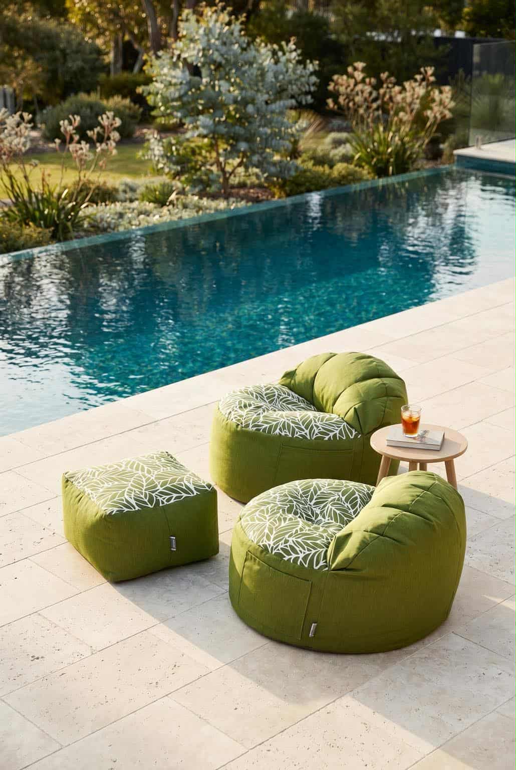 Lazy Beanz Island Palm Green outdoor bean bags and square ottoman beside a swimming pool
