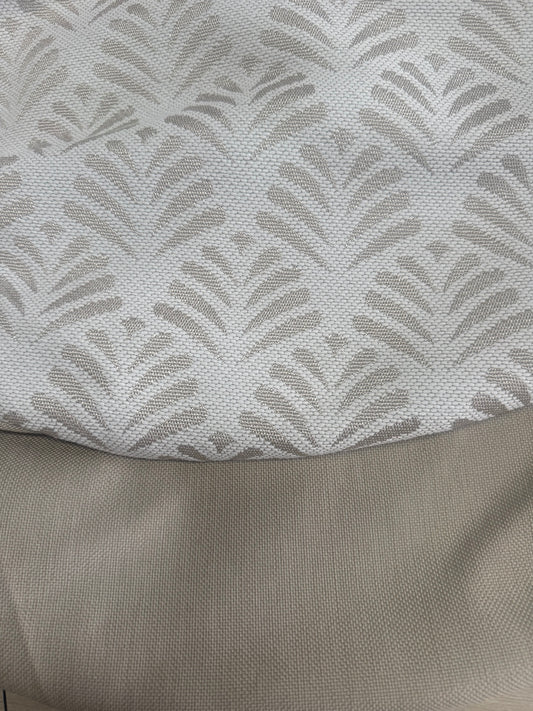 Fabric close-up showing lighter cream and taupe face of Sosa Natural combined with Lomani Shell for one-off small round ottoman